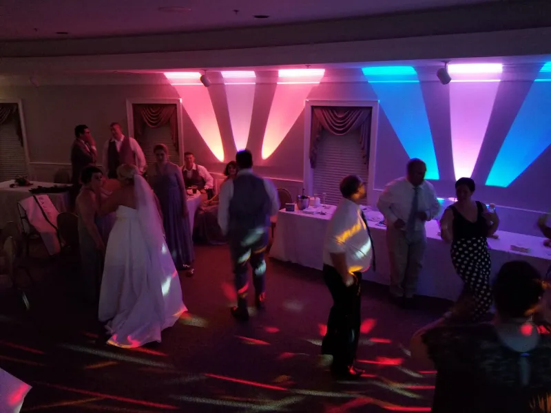 Dancing under colorful uplighting